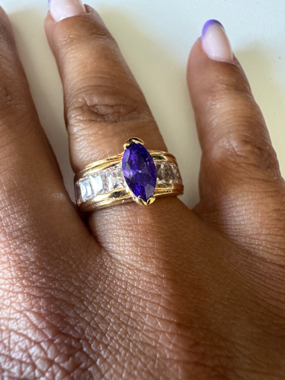 Gold-Plated Ring with Deep Purple Marquise Gem and Clear Accent Stones